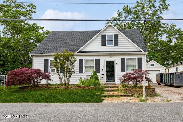 110 W 4th St, Howell, NJ 07731 - view of front of property with an outbuilding, roof with shingles, and a detached garage