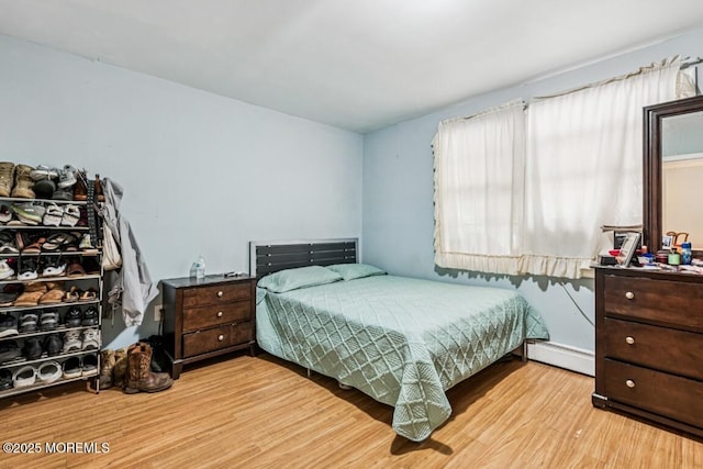 110 W 4th St, Howell, NJ 07731 - bedroom featuring baseboard heating and wood finished floors