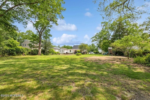 110 W 4th St, Howell, NJ 07731 - view of green lawn featuring a playground