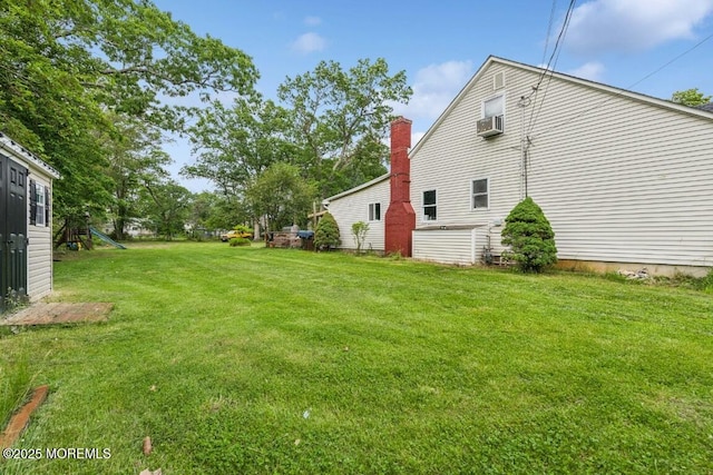 110 W 4th St, Howell, NJ 07731 - view of grassy yard with a playground and cooling unit