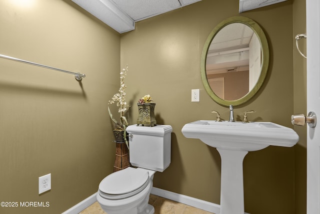 18 Hampton Rd, Howell, NJ 07731 - half bath with toilet, baseboards, and tile patterned floors