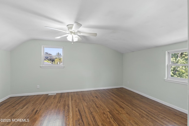 18 Hampton Rd, Howell, NJ 07731 - additional living space featuring lofted ceiling, healthy amount of natural light, baseboards, a ceiling fan, and dark wood-style floors