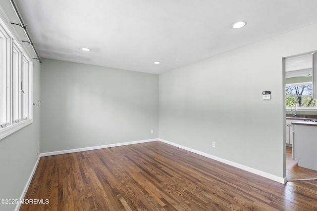 18 Hampton Rd, Howell, NJ 07731 - spare room featuring wood finished floors, recessed lighting, baseboards, and a sink