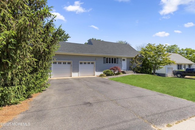 18 Hampton Rd, Howell, NJ 07731 - ranch-style house with driveway, a garage, a front lawn, and a shingled roof