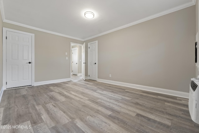 2A Primrose Ln, Jackson, NJ 08527 - unfurnished living room with baseboards, wood finished floors, and ornamental molding
