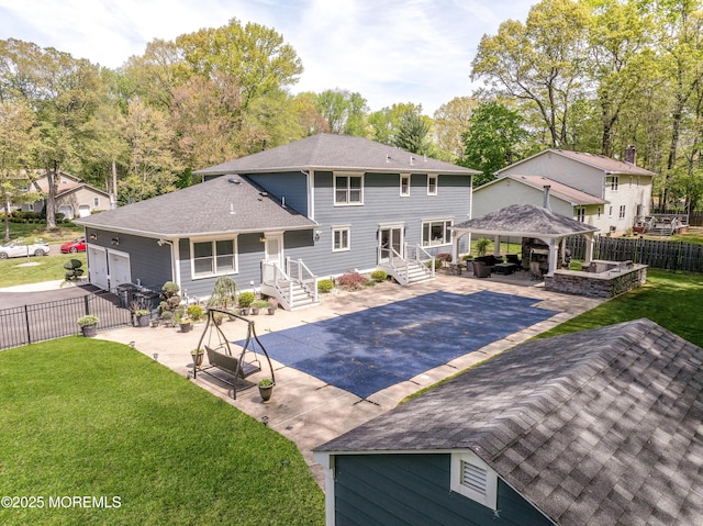 25 Briar Hill Dr, Manalapan, NJ 07726 - rear view of property featuring a gazebo, a shingled roof, driveway, and a patio area