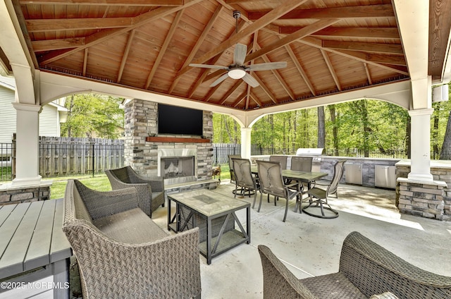 25 Briar Hill Dr, Manalapan, NJ 07726 - view of patio featuring an outdoor stone fireplace, a gazebo, outdoor dining area, and a ceiling fan