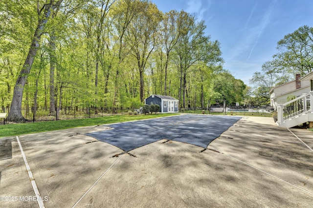 25 Briar Hill Dr, Manalapan, NJ 07726 - view of property's community featuring an outdoor structure and uncovered parking