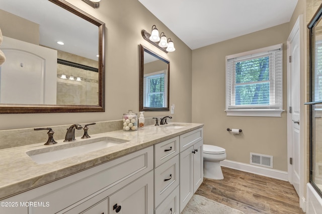 25 Briar Hill Dr, Manalapan, NJ 07726 - bathroom with double vanity, an enclosed shower, baseboards, toilet, and wood finished floors