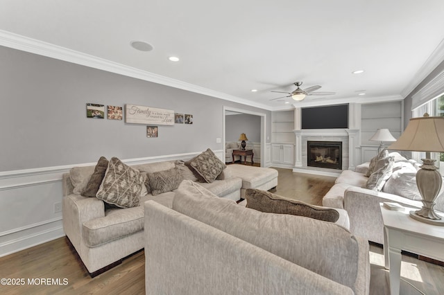 25 Briar Hill Dr, Manalapan, NJ 07726 - living room featuring ceiling fan, ornamental molding, wood finished floors, a glass covered fireplace, and recessed lighting