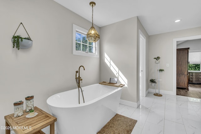 25 Glenview Rd, North Caldwell, NJ 07006 - bathroom featuring a freestanding tub, marble finish floors, baseboards, and recessed lighting