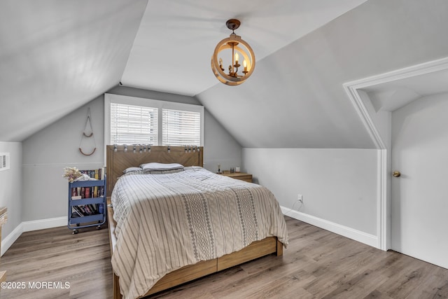 25 Glenview Rd, North Caldwell, NJ 07006 - bedroom with wood finished floors, lofted ceiling, a chandelier, and baseboards