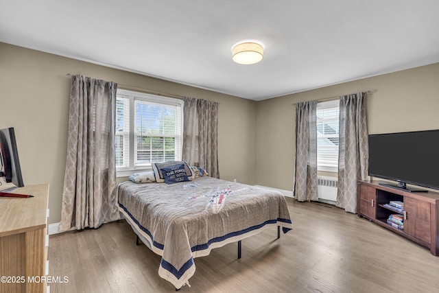 25 Glenview Rd, North Caldwell, NJ 07006 - bedroom with radiator heating unit, multiple windows, wood finished floors, and baseboards