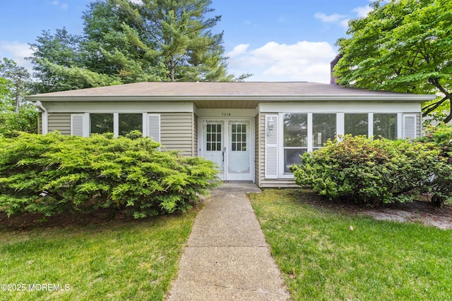 731A Chatham Ln, Manchester, NJ 08759 - view of front facade featuring a chimney and a front yard