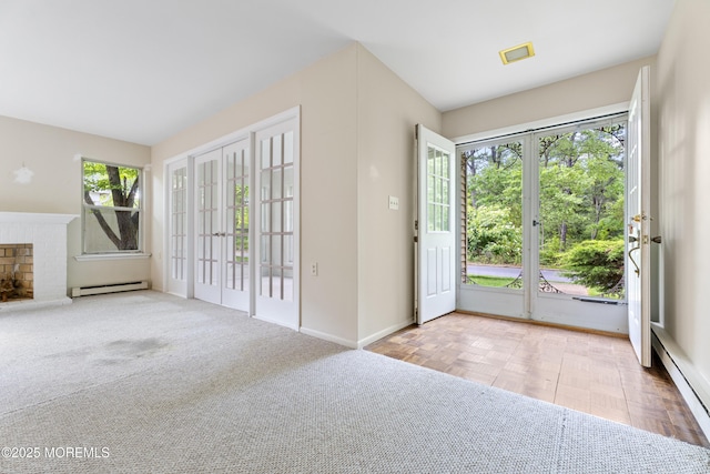 731A Chatham Ln, Manchester, NJ 08759 - foyer entrance featuring baseboard heating, baseboards, french doors, and a brick fireplace