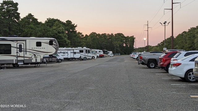 731A Chatham Ln, Manchester, NJ 08759 - uncovered parking lot featuring view of wooded area