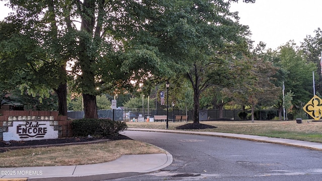 731A Chatham Ln, Manchester, NJ 08759 - view of asphalt road with sidewalks, curbs, and street lighting