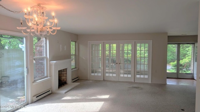 731A Chatham Ln, Manchester, NJ 08759 - unfurnished living room with a baseboard radiator, plenty of natural light, a chandelier, and a baseboard heating unit