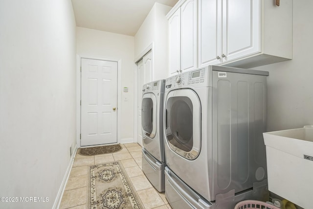 5 Duke Dr, Howell, NJ 07731 - laundry room featuring washing machine and clothes dryer, cabinet space, and light tile patterned floors