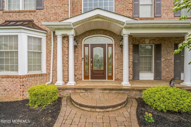 5 Duke Dr, Howell, NJ 07731 - view of exterior entry featuring a porch and brick siding