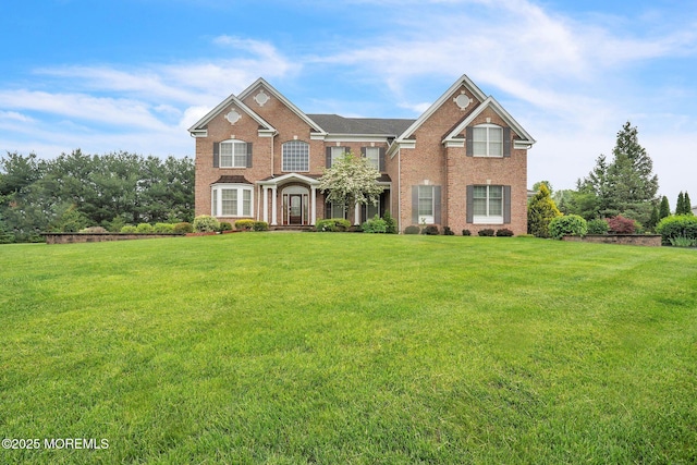 5 Duke Dr, Howell, NJ 07731 - view of front of house featuring brick siding and a front yard