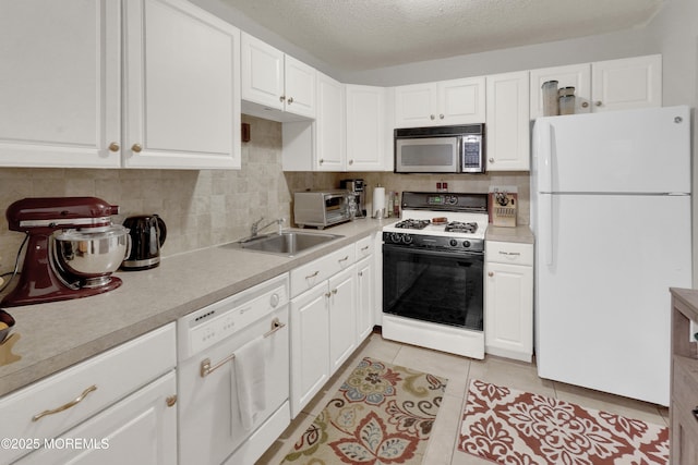 104 Deerfoot Way, Jackson, NJ 08527 - kitchen with white appliances, a sink, light countertops, white cabinetry, and decorative backsplash