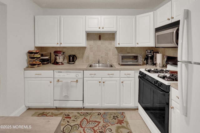 104 Deerfoot Way, Jackson, NJ 08527 - kitchen with white appliances, a sink, light tile patterned floors, light countertops, and white cabinetry