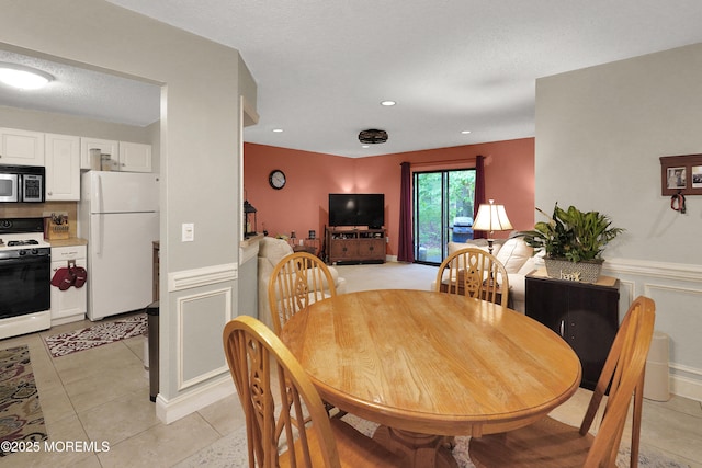 104 Deerfoot Way, Jackson, NJ 08527 - dining room with light tile patterned floors, wainscoting, and recessed lighting