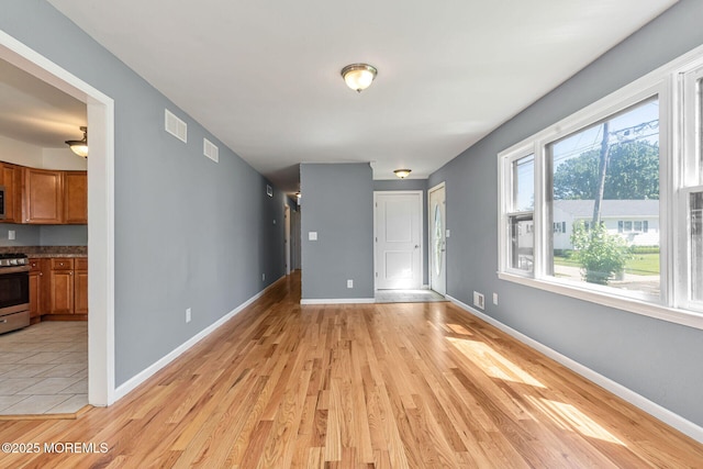 7 Beechwood Ave, Keansburg, NJ 07734 - empty room with light wood-style floors and baseboards