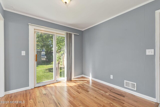 7 Beechwood Ave, Keansburg, NJ 07734 - unfurnished room with light wood finished floors, baseboards, and crown molding
