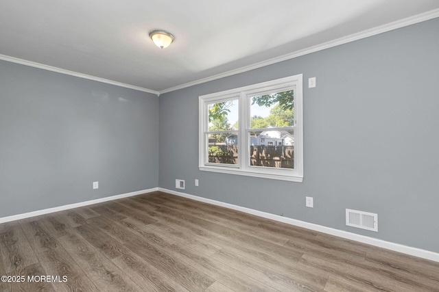7 Beechwood Ave, Keansburg, NJ 07734 - empty room with ornamental molding, baseboards, and wood finished floors