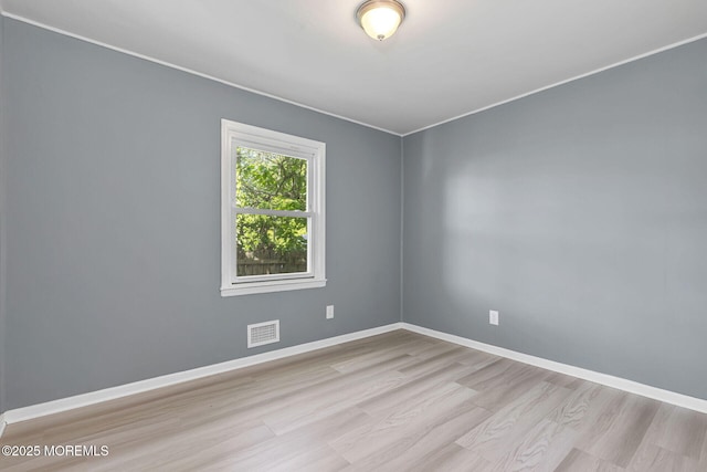 7 Beechwood Ave, Keansburg, NJ 07734 - spare room with wood finished floors, baseboards, and crown molding