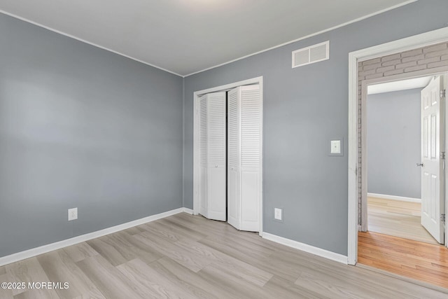 7 Beechwood Ave, Keansburg, NJ 07734 - unfurnished bedroom featuring wood finished floors, a closet, ornamental molding, and baseboards