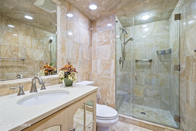 787 Ocean Ave Unit 1711, Long Branch, NJ 07740 - full bathroom with tile walls, toilet, vanity, and a stall shower