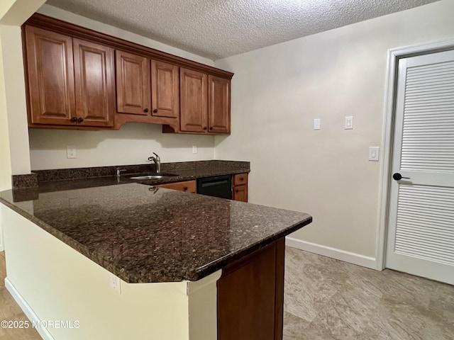 5 Lincoln Ct, Tinton Falls, NJ 07712 - kitchen with a sink, a peninsula, dark stone countertops, a textured ceiling, and dishwasher