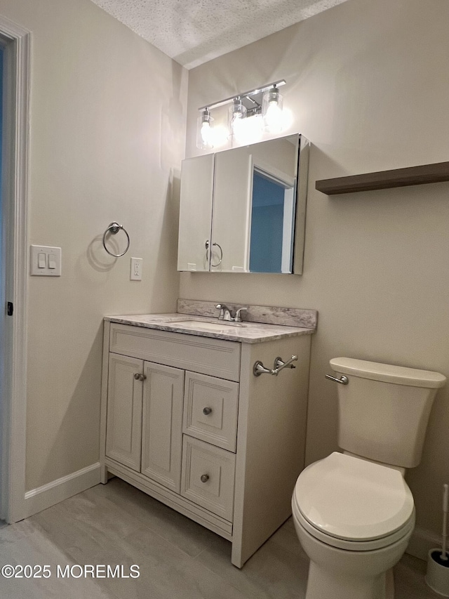 5 Lincoln Ct, Tinton Falls, NJ 07712 - bathroom featuring vanity, a textured ceiling, and toilet