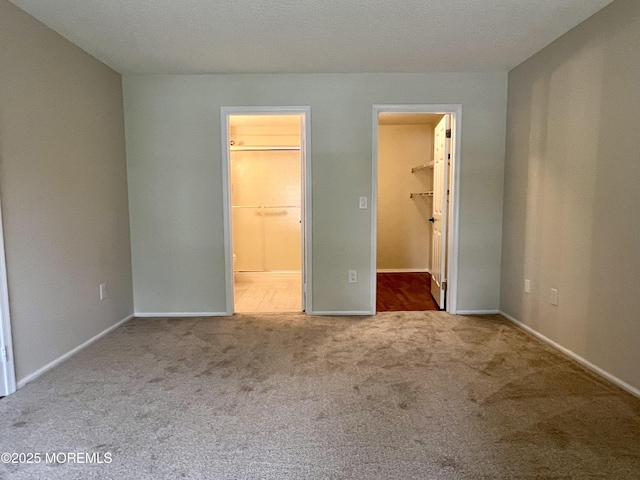 5 Lincoln Ct, Tinton Falls, NJ 07712 - unfurnished bedroom featuring carpet floors, a spacious closet, baseboards, and connected bathroom