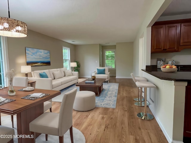 5 Lincoln Ct, Tinton Falls, NJ 07712 - living area with light wood-style flooring, plenty of natural light, a chandelier, and baseboards