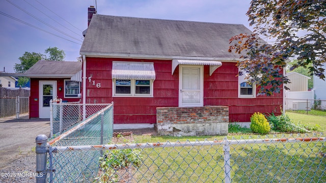 116 Hudson Ave, Hazlet, NJ 07734 - view of front facade with a fenced front yard, a chimney, a gate, and roof with shingles