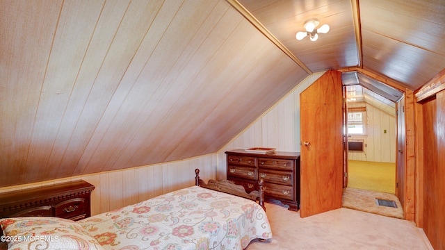116 Hudson Ave, Hazlet, NJ 07734 - bedroom with carpet flooring, wooden walls, and vaulted ceiling