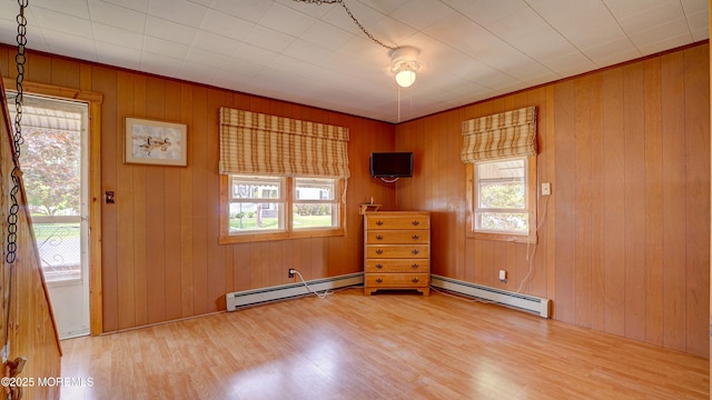 116 Hudson Ave, Hazlet, NJ 07734 - empty room with wood finished floors, healthy amount of natural light, and wood walls
