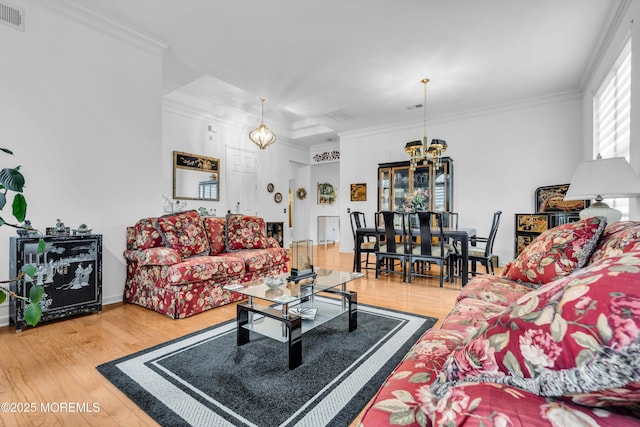 34 Shoal Rd, Jackson, NJ 08527 - living area featuring a chandelier, wood finished floors, crown molding, and baseboards
