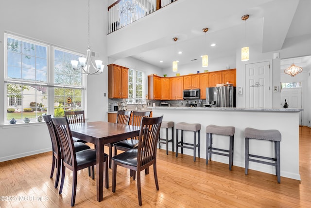 34 Shoal Rd, Jackson, NJ 08527 - dining room featuring a chandelier, light wood-style floors, a towering ceiling, baseboards, and recessed lighting