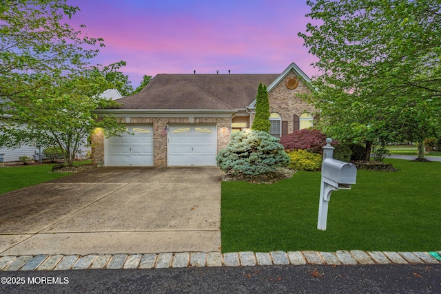 34 Shoal Rd, Jackson, NJ 08527 - view of front facade with a garage, driveway, a lawn, brick siding, and roof with shingles
