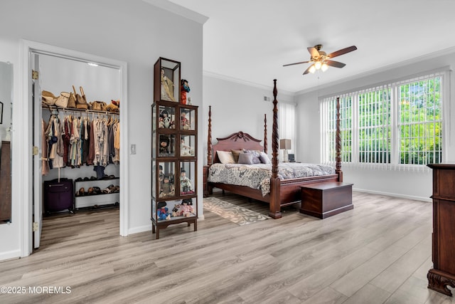 34 Shoal Rd, Jackson, NJ 08527 - bedroom featuring ornamental molding, a spacious closet, light wood-style flooring, a closet, and baseboards