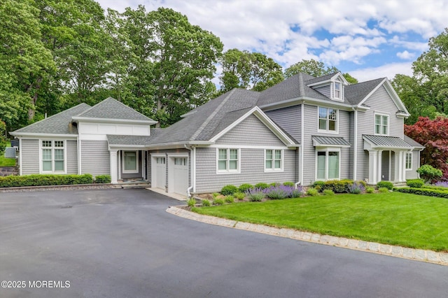 12 Wagon Way, Holmdel, NJ 07733 - view of front of house with an attached garage, driveway, roof with shingles, and a front lawn