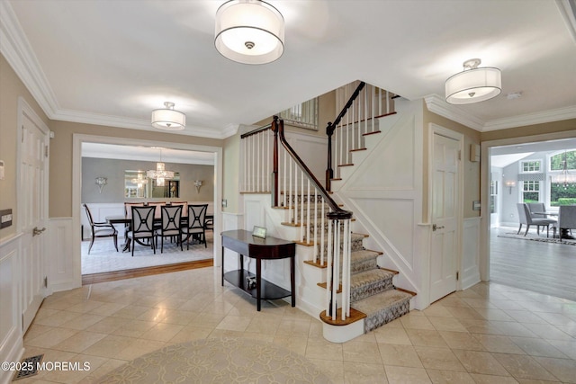 12 Wagon Way, Holmdel, NJ 07733 - staircase with a decorative wall, tile patterned flooring, ornamental molding, a chandelier, and wainscoting