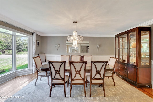 12 Wagon Way, Holmdel, NJ 07733 - dining room featuring a chandelier, ornamental molding, light wood-type flooring, a decorative wall, and wainscoting