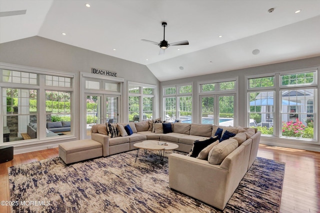 12 Wagon Way, Holmdel, NJ 07733 - living area featuring vaulted ceiling, plenty of natural light, a ceiling fan, wood-type flooring, and french doors