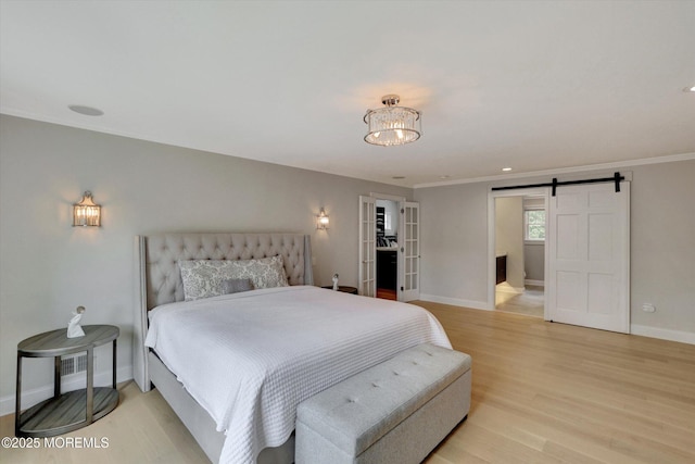 12 Wagon Way, Holmdel, NJ 07733 - bedroom with baseboards, light wood-style floors, a barn door, and crown molding